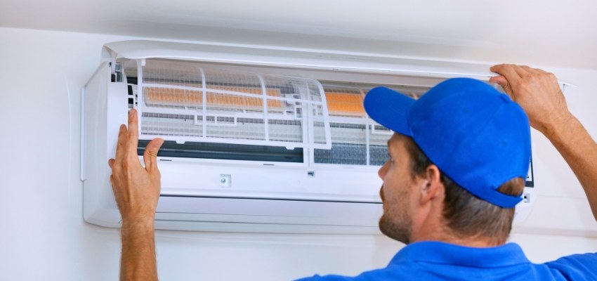 Technician servicing an HVAC unit, demonstrating practical steps for how often to change hvac filter.