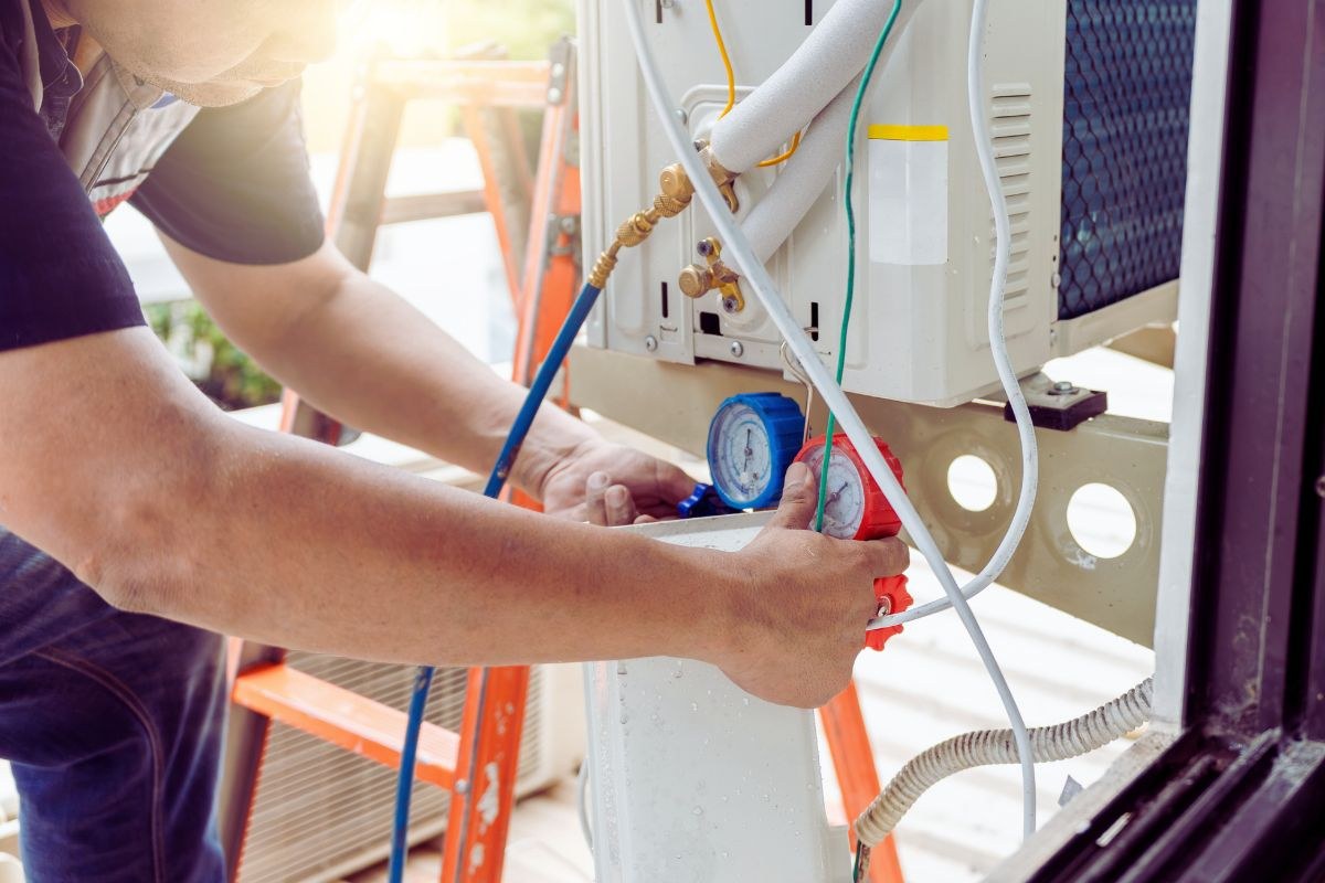 HVAC maintenance checks the static pressure of the HVAC unit.