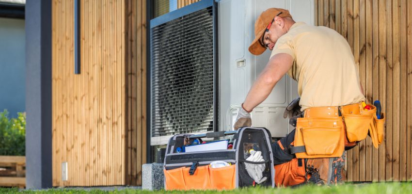 The expert installs a heat pump system.