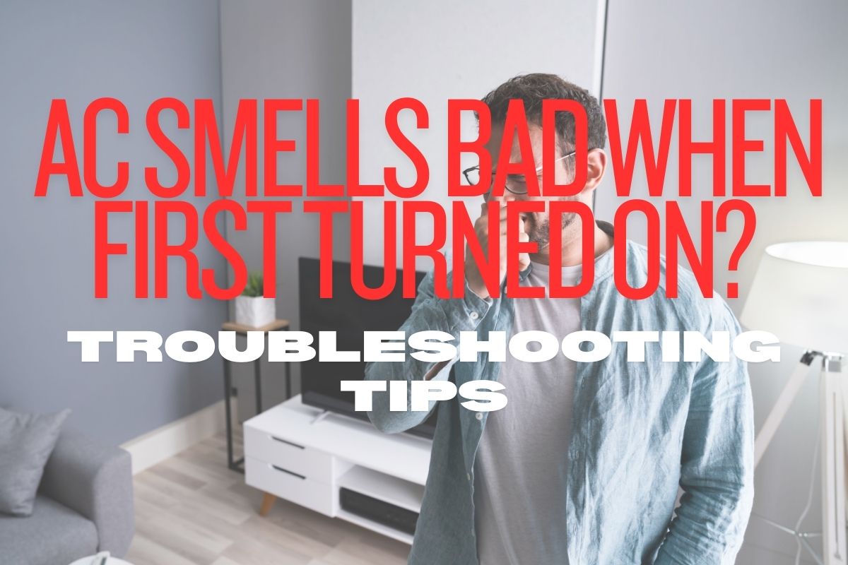 The man covered his nose because the AC smelled bad when he first turned it on.