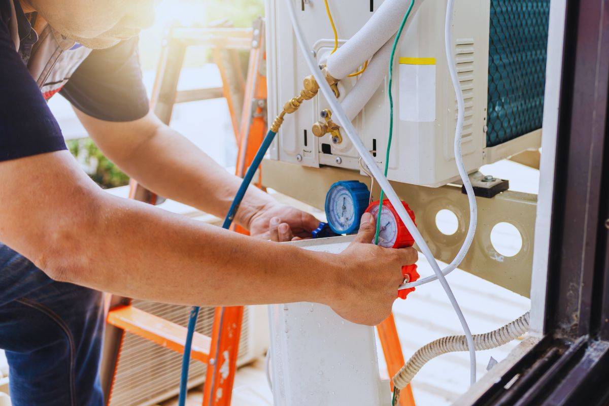 The expert checks the refrigerant of the AC system.