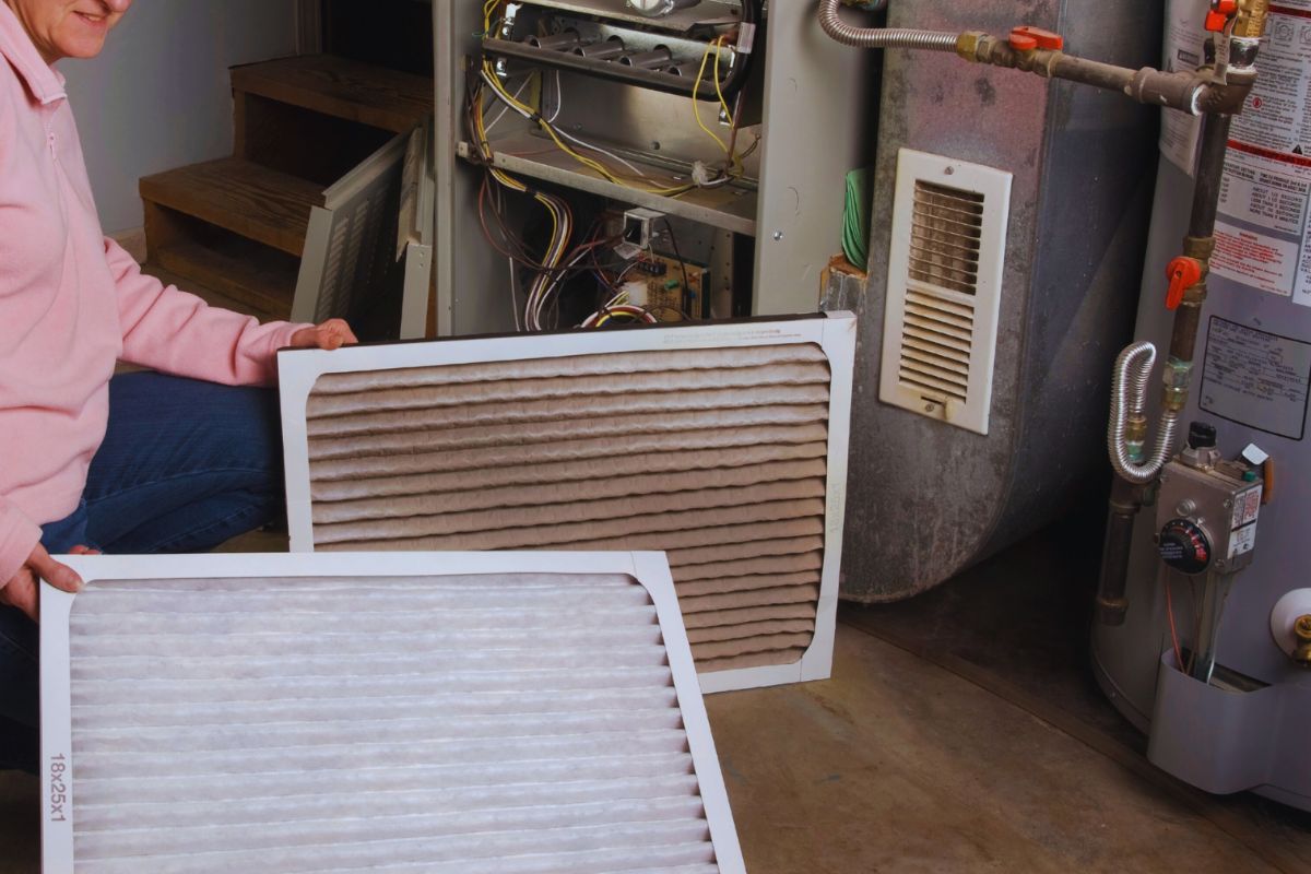 An HVAC professional demonstrates MERV 8 and MERV 11 filters.
